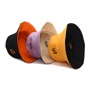 Reversible cotton bucket hats with letter embroidery in various contrast color combinations