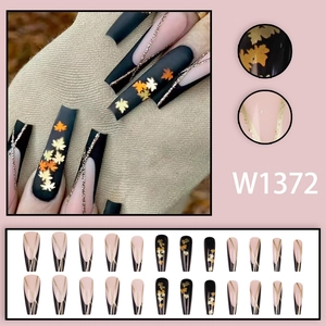 Long coffin press-on nails with black pink autumn maple leaf patterns and gold glitter