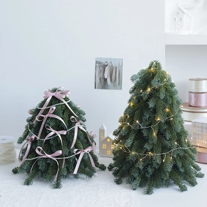Desktop PE artificial Nobel fir Christmas trees with LED lights and pink ribbon decorations