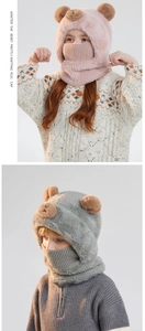 Detail of plush winter bear hat with neck warmer and knit face mask in pink and grey
