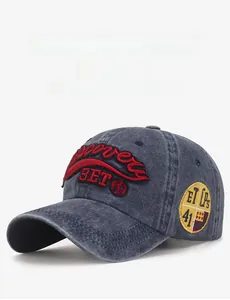 Macro detail of washed vintage baseball cap with embroidered patches and distressed fabric