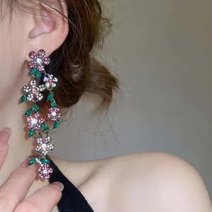 Vintage floral tassel earrings with sparkling pink crystals and green leaf stones