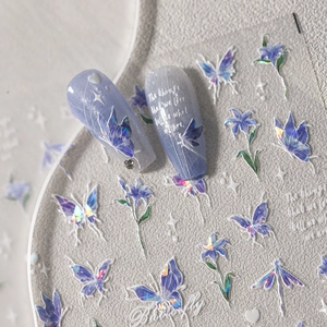 Holographic butterfly and flower nail stickers with gold stamping on stone background