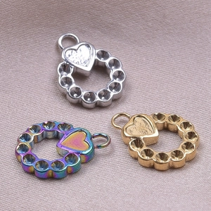 Three heart charms in silver, gold, and rainbow finishes for DIY necklace making