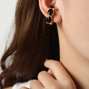 French style 18K gold plated hoop ear cuff featuring three oval black stones on ear