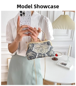 Detailed view of vintage floral jacquard handbag with gold metal handle and chain strap