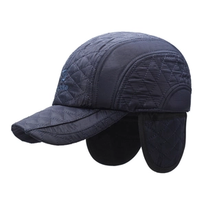 Winter quilted baseball cap with ear flaps in navy blue and thermal fleece lining