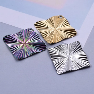 Macro view of 304 stainless steel rhombus pendants in gold, silver, and rainbow colors