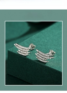 Macro shot of S925 sterling silver stud earrings with multi-layer pave cubic zirconia