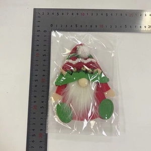 Close-up of a 13cm Christmas gnome plush pendant with red and green festive details