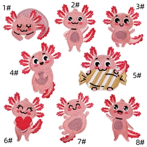 Detailed embroidery view of 8 different pink axolotl cartoon iron-on fabric patches