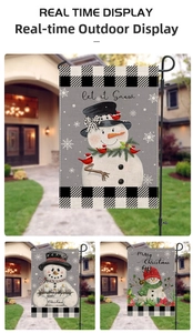 Detailed view of snowman Christmas garden flags displayed in an outdoor garden setting