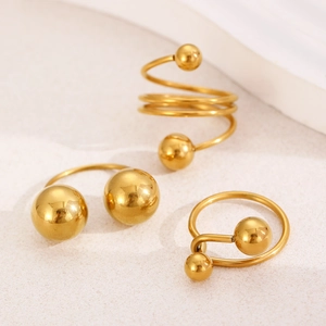 Minimalist gold-plated stainless steel ring set with geometric spheres and spiral design