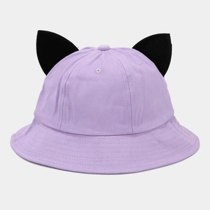 Detail of purple cotton bucket hat featuring black devil ears and twill fabric texture