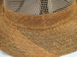 Detail of breathable mesh splicing and woven straw texture on sun hat brim