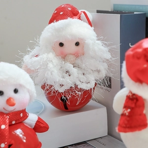 Detail of plush Santa and Snowman heads on red metal Christmas jingle bell ornaments