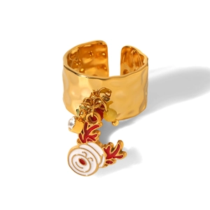 Detailed view of golden hammered ring featuring a cartoon reindeer pendant with enamel