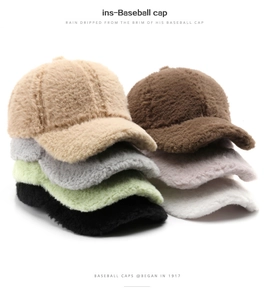 Close-up of fluffy plush baseball caps in various solid colors for winter warmth