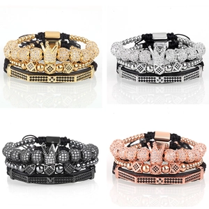 Detail view of four-piece men's bracelet sets in gold, silver, black, and rose gold