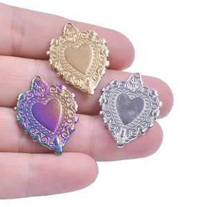 Vintage heart shaped stainless steel pendants with engraved scroll patterns in three colors