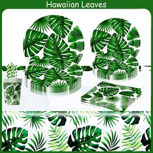 Hawaiian tropical party supplies set with green palm leaves paper plates and napkins