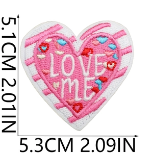 Macro detail of LOVE ME heart embroidery patch with size dimensions 5.3x5.1cm