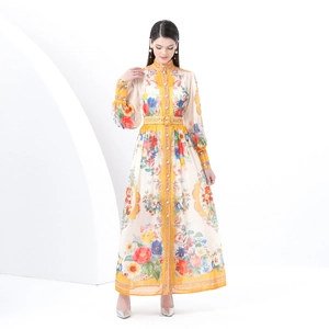 Floral print bohemian maxi dress with stand collar and lantern sleeves on a model