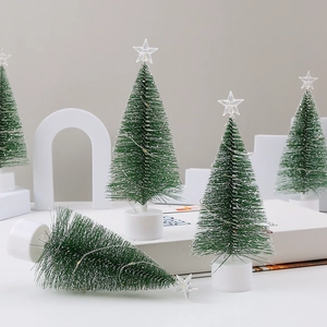 Macro detail of mini pine needle Christmas tree with LED lights and white base