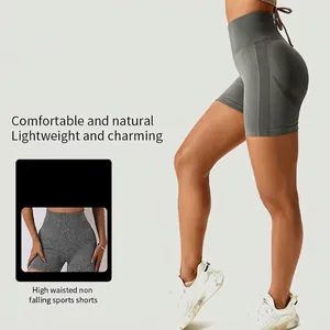 Grey high-waisted seamless yoga shorts with honeycomb texture and peach butt lifting fit