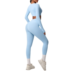 Women's two-piece yoga set with long sleeve crop top and high waist leggings in light blue