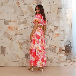 Detail of elegant backless design and floral print fabric on the maxi dress