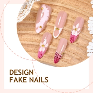 Handmade almond press-on nails with 3D floral art and pink gradient design