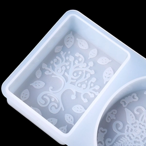 Macro detail of a silicone mold featuring a tree of life pattern for handmade soaps