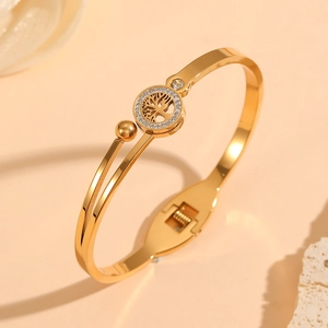Close-up of 18K gold-plated Tree of Life bangle with sparkling crystal halo setting