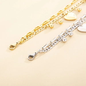Double-layered stainless steel chain bracelet with heart charms in gold and silver finish