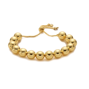 Detailansicht eines verstellbaren goldenen Perlenarmbands mit Hochglanzfinish und Zugverschluss