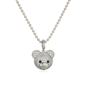 Macro shot of silver ball chain necklace featuring a 3D teddy bear pendant with clear pavé zircons