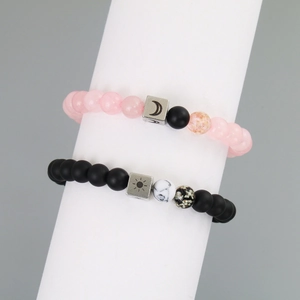 Luminous sun and moon beaded couple bracelets with matte black and pink resin stones