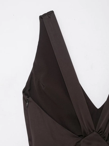 Detail of deep brown satin dress showing hidden side zipper and wide shoulder straps