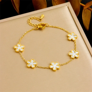 Elegant gold titanium steel bracelet with white shell five-petal flower charms