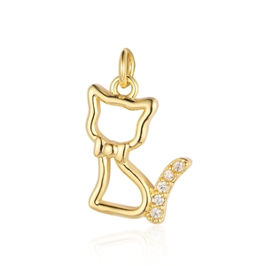 Macro view of gold cat pendant with hollow design and zircon tail detail