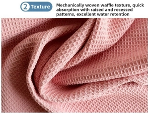 Macro shot of pink waffle weave cotton fabric showing high-absorbent texture detail