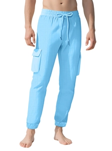 Detail of light blue cargo pants showing waffle knit texture and side pocket design