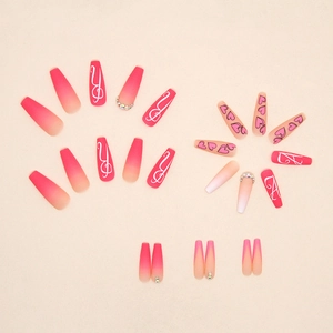 Long ballerina press-on nails with pink gradient, white art lines, and small rhinestones
