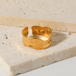 Irregular tin foil texture gold plated titanium steel open ring on travertine stones