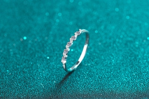Detailed 45-degree angle of S925 sterling silver ring with nine sparkling moissanite stones