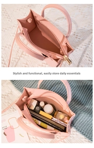 Interior view showing spacious capacity of the pink crocodile texture tote bag with zip pocket