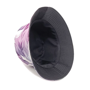 Detail of double-sided bucket hat with purple floral pattern and black lining