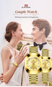 Close-up of gold couple watches with diamond dials and calendar set on wedding background