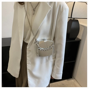 Silver mirror mini box bag with chunky metal chain shown with white blazer outfit